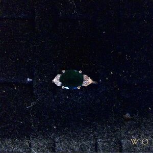 Emerald ring with diamonds.